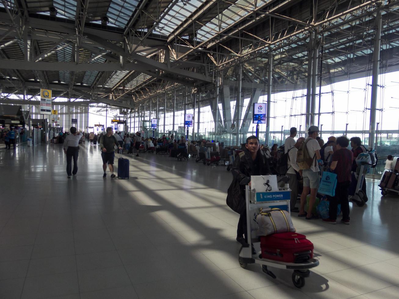 Suvarnabhumi BANGKOK THAILAND31 OCTOBER 2018In the airport passengers are walking to different areas of the airport. Suvarnabhumi Airport is Thailands main airport.0n BANGKOK THAILAND. photo