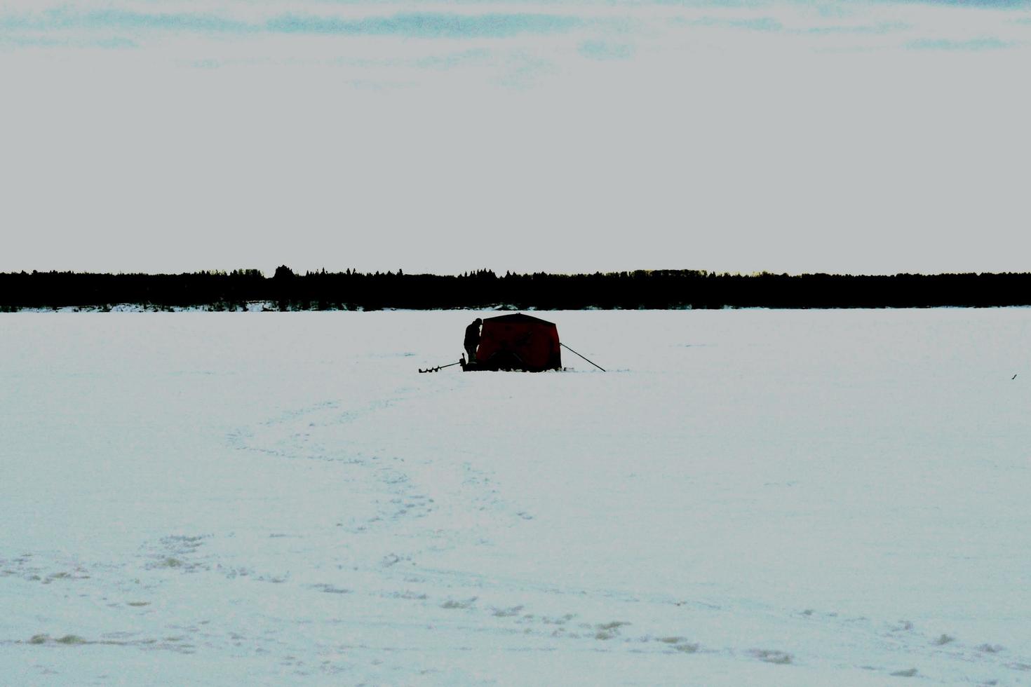winter in Manitoba - ice fishing on a frozen lake photo