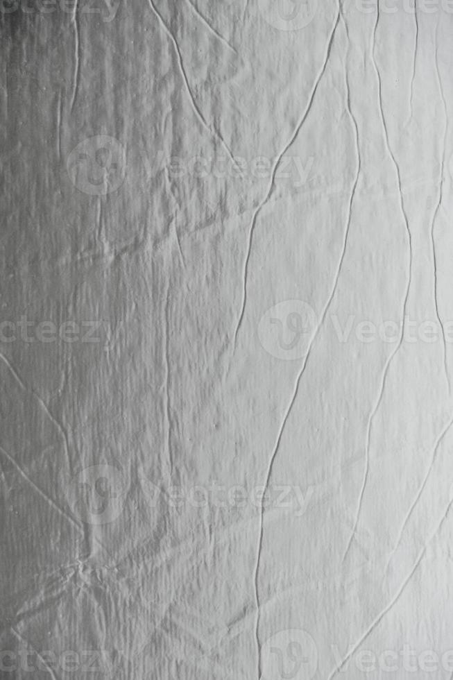 Aluminum silver foil as a background texture image. Top view. Copy, empty space for text photo