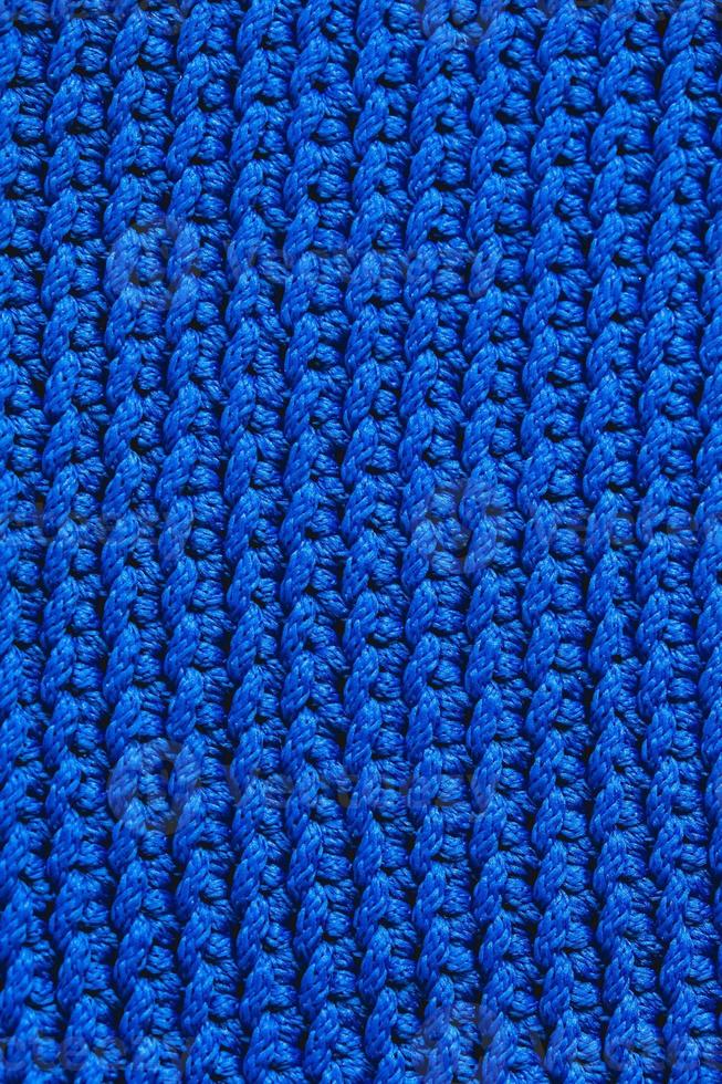 Blue knitted fabric texture background photo