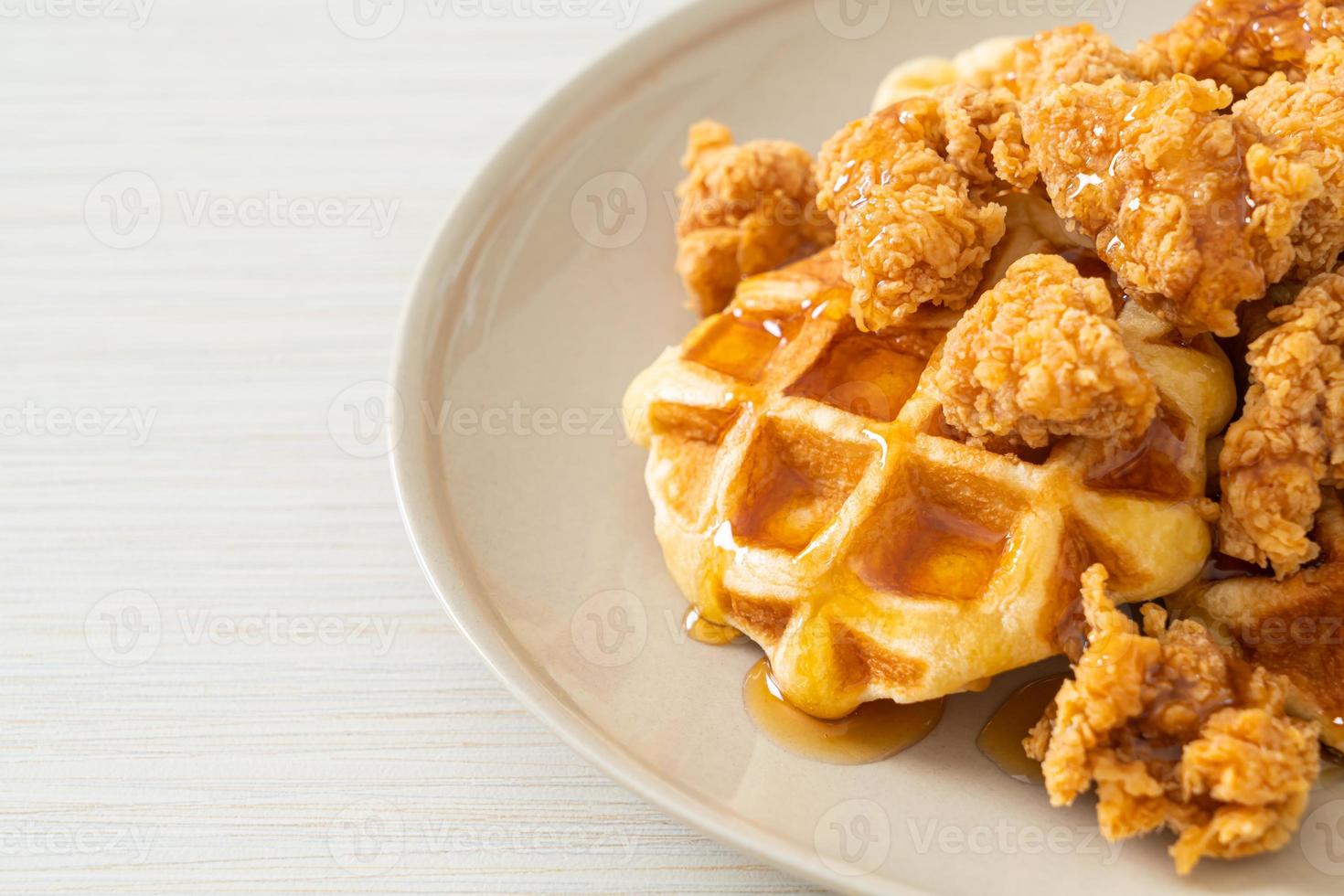 fried chicken waffle with honey or maple syrup photo