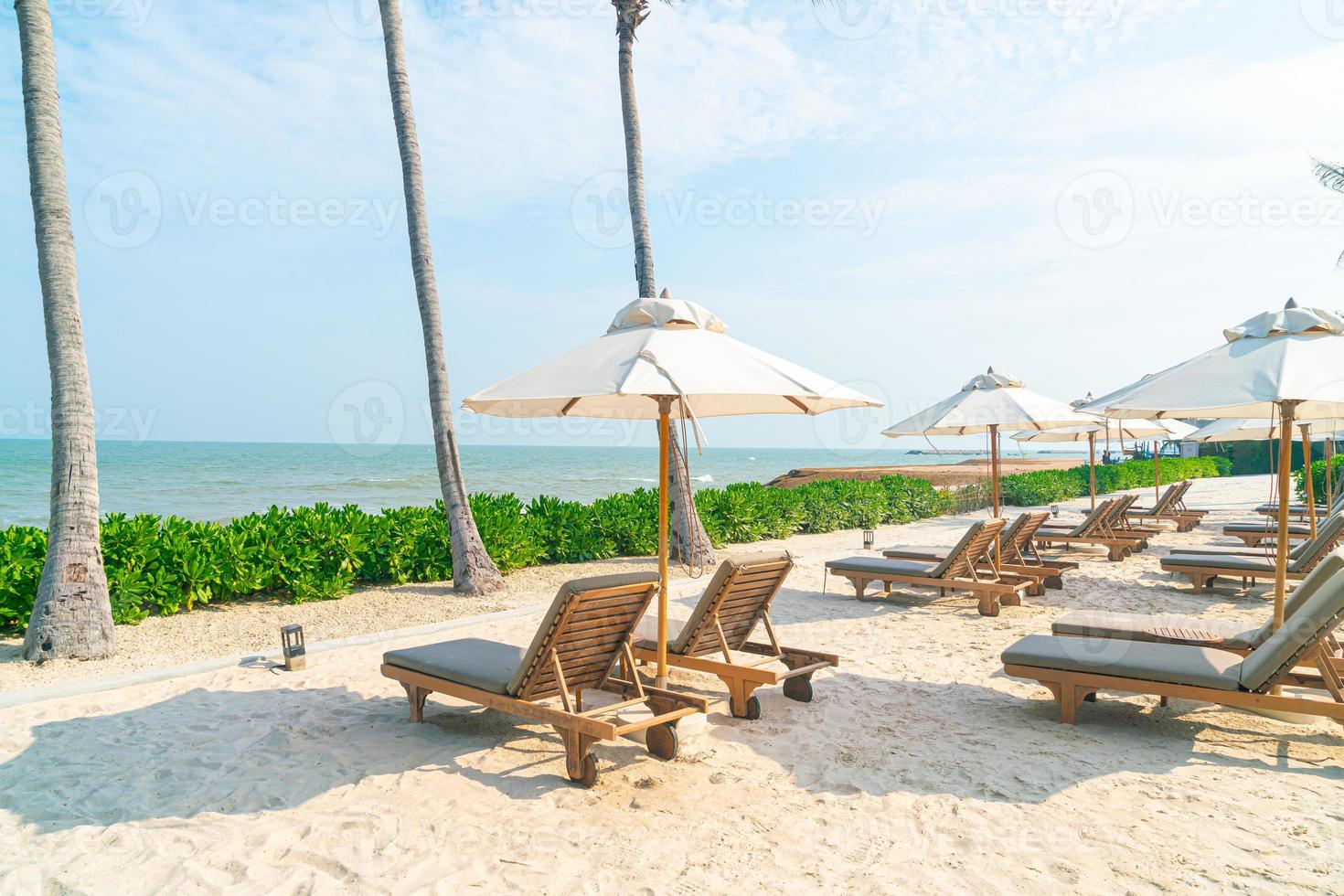 umbrella with beach chair and ocean sea background photo