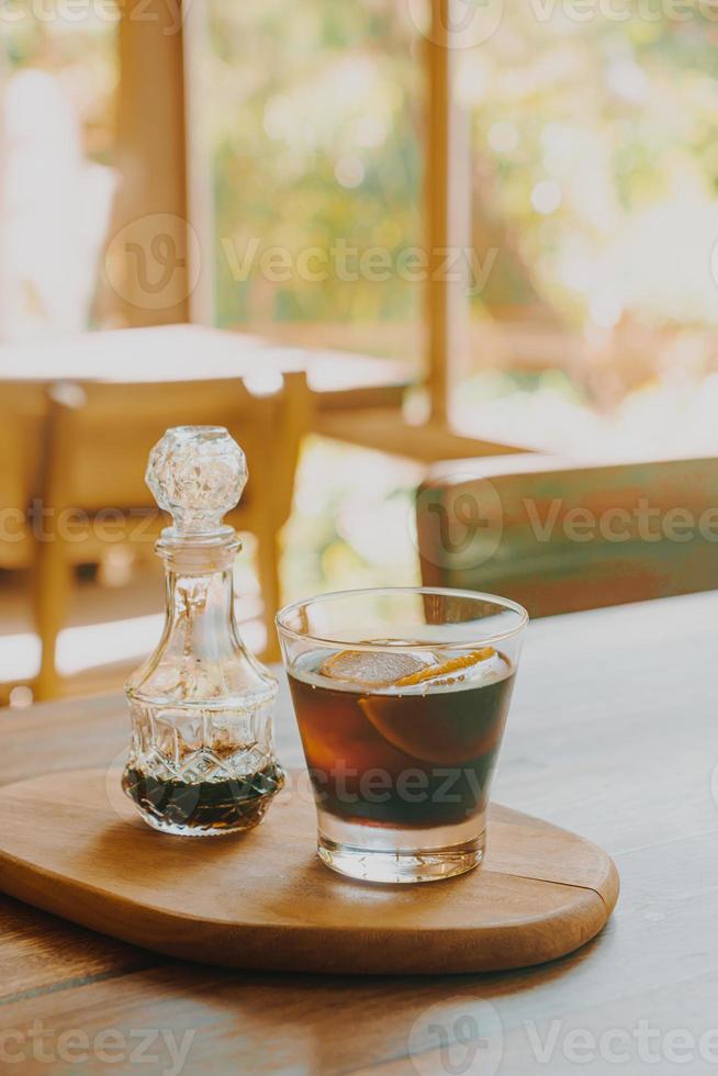 iced cold brew coffee on wood tray photo