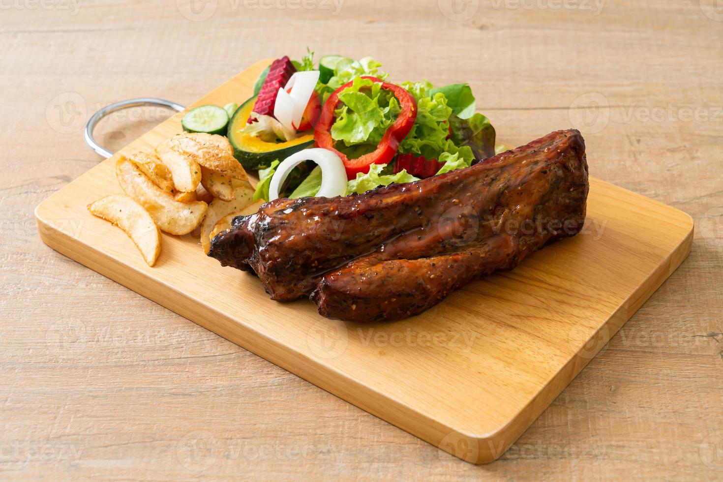 barbecue pork spare ribs with vegetables photo
