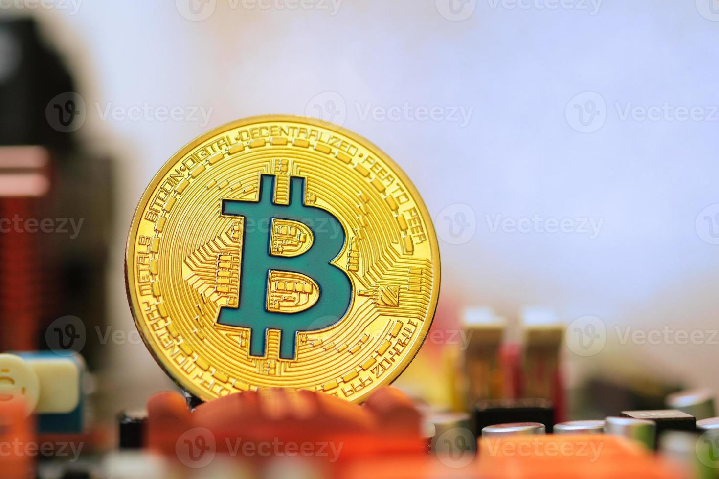 Bitcoin crypto currency on circuit board .virtual money.blockchain technology.mining concept photo