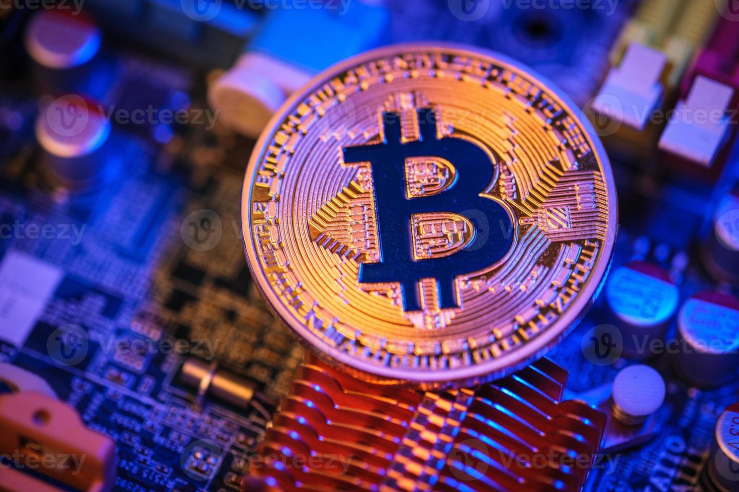 Bitcoin crypto currency on circuit board .virtual money.blockchain technology.mining concept photo