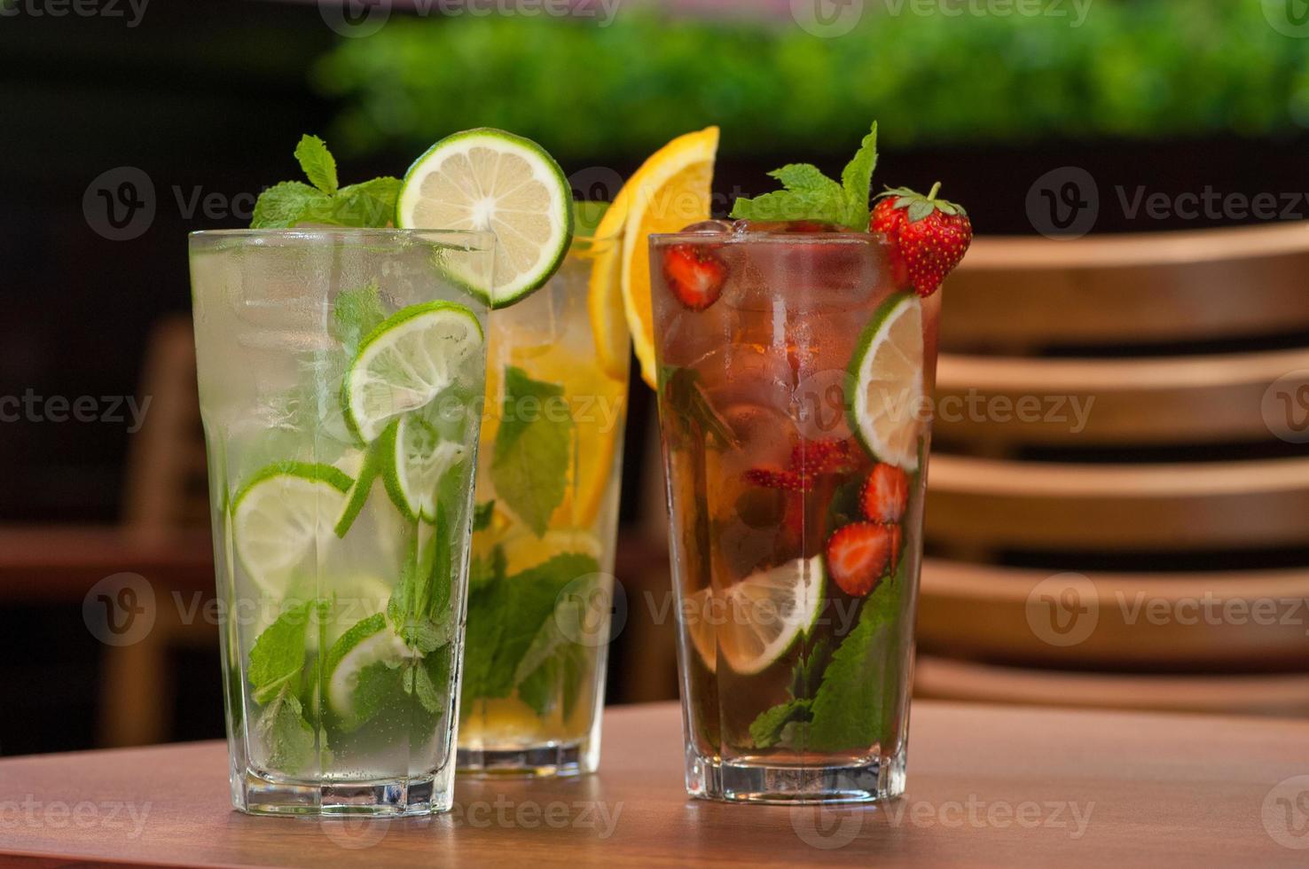 cold drink with citrus on the table photo