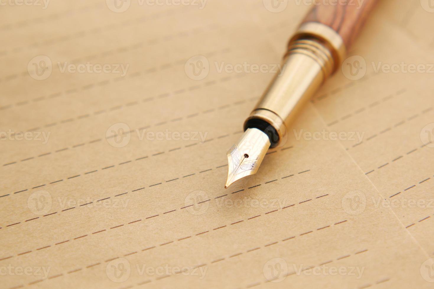 envelope , empty paper and fountain pen on table photo