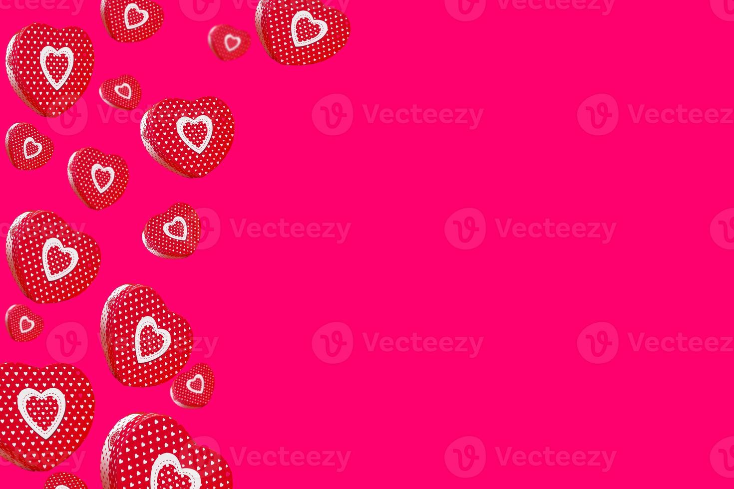 Flying red heart shaped gift boxes isolated on red background. Banner or postcard for valentine's day. copy space photo