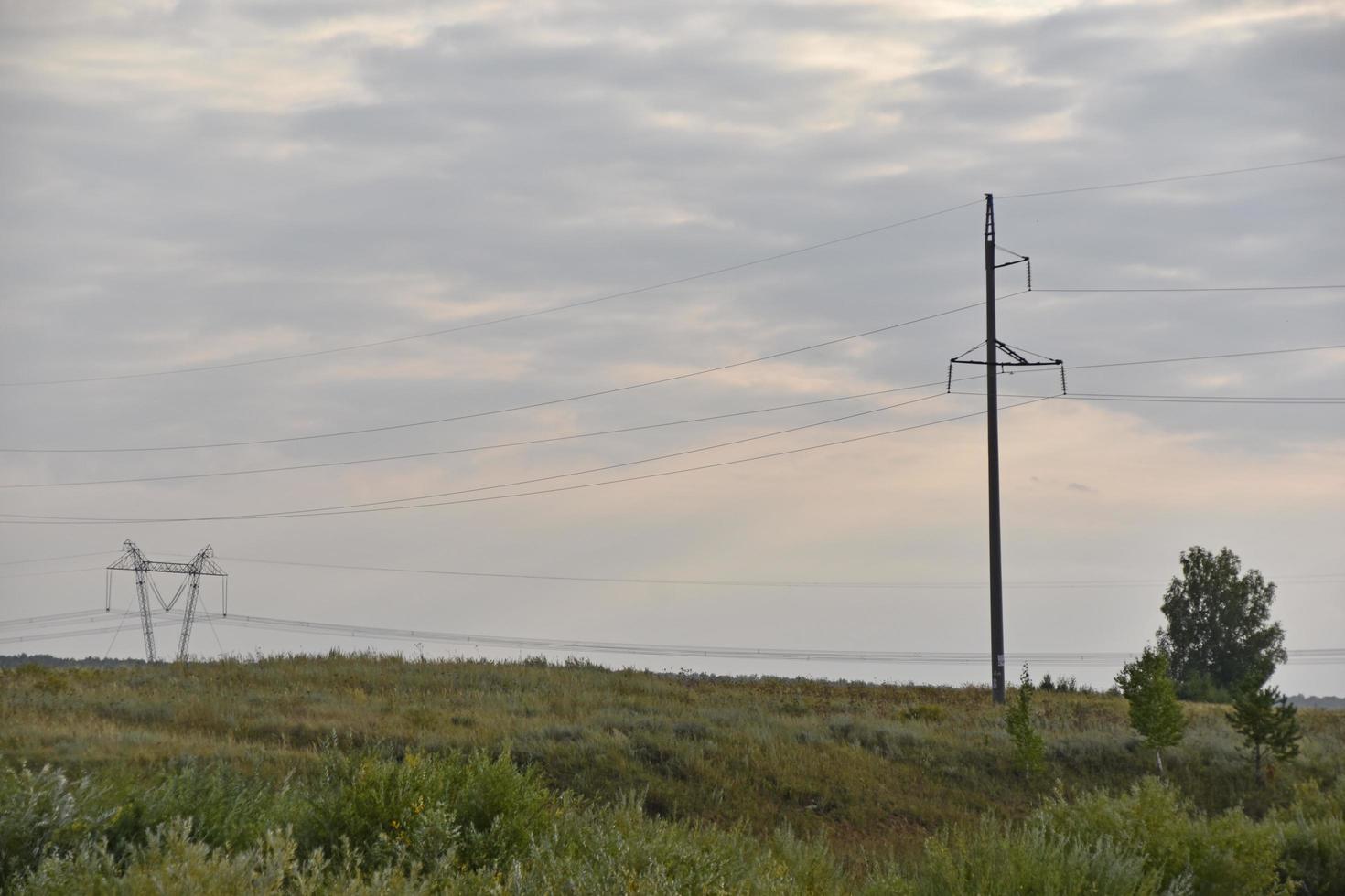 High voltage power line in the steppe field photo
