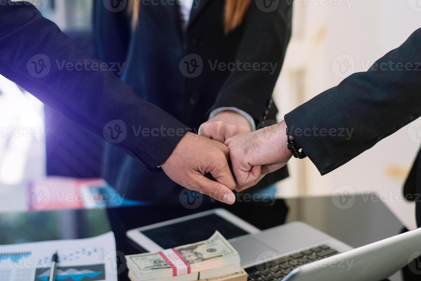 Close up on hands of business people join together their hands together on unity concept photo
