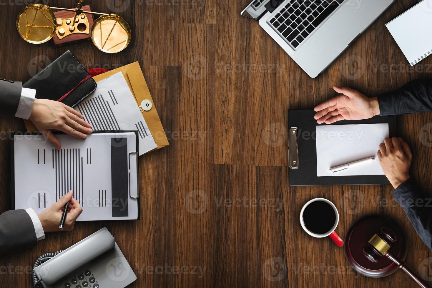 Top view Business and lawyers discussing contract papers with brass scale on desk in office. Law, legal services, advice, justice and law photo