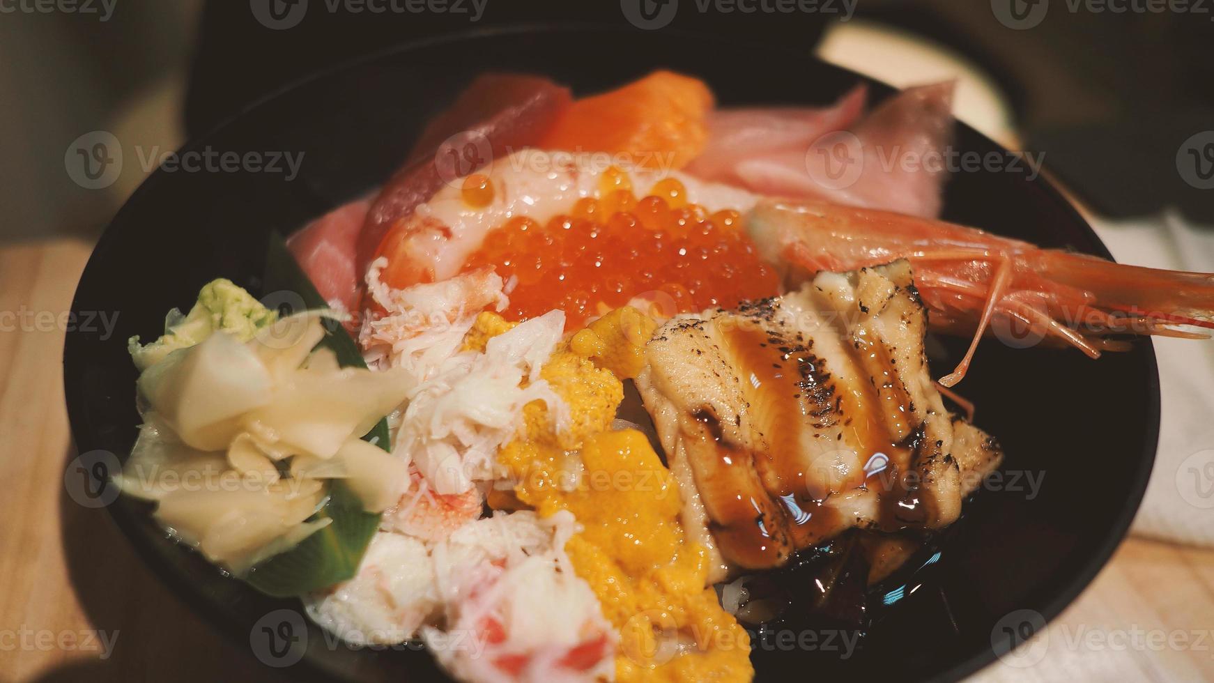 Close up images of japanese seafood rice bowl or kaisendon sashimi donburi. photo