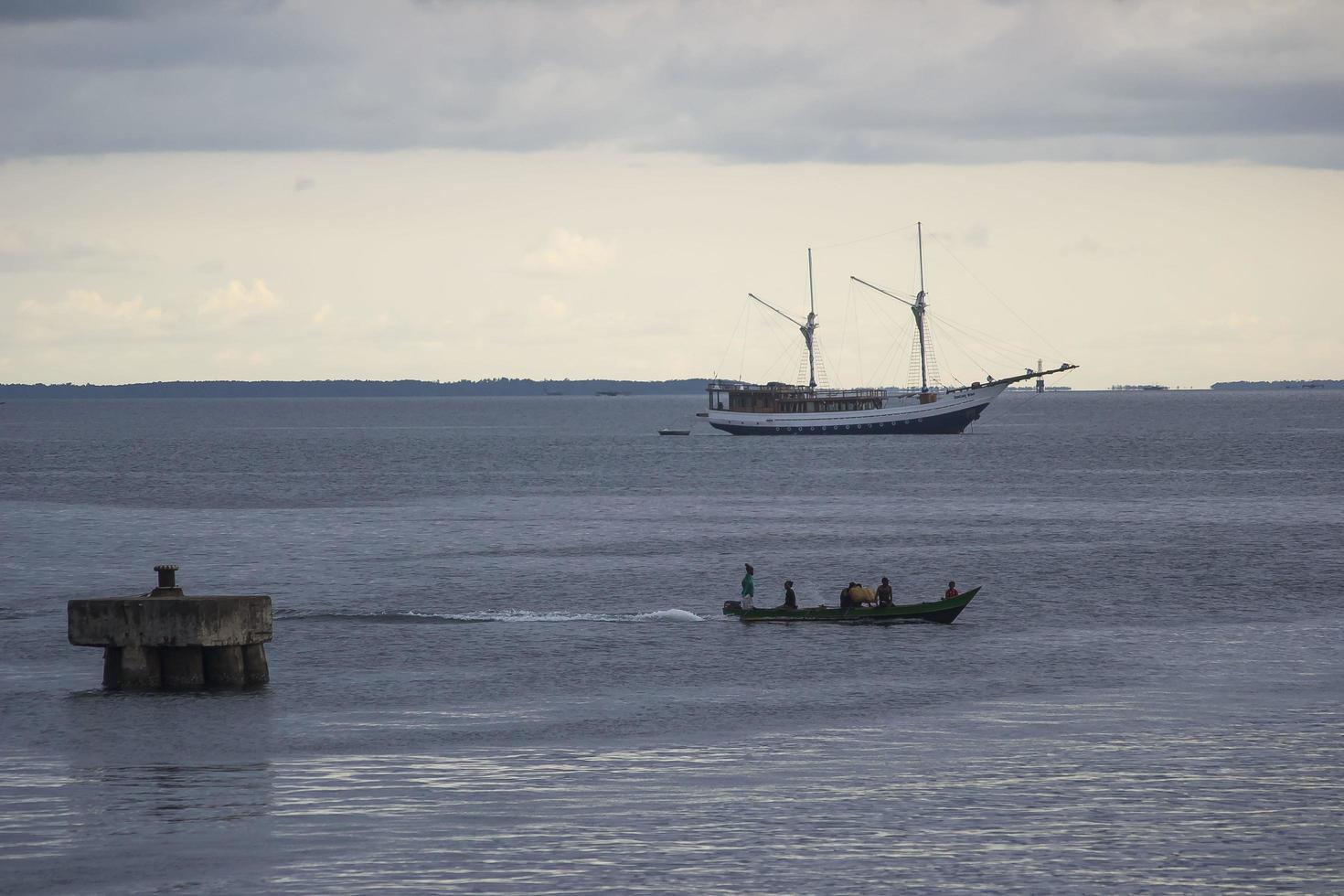 Sorong, West Papua, Indonesia, September 30th 2021. The villagers cross the waters of sorong using boats photo
