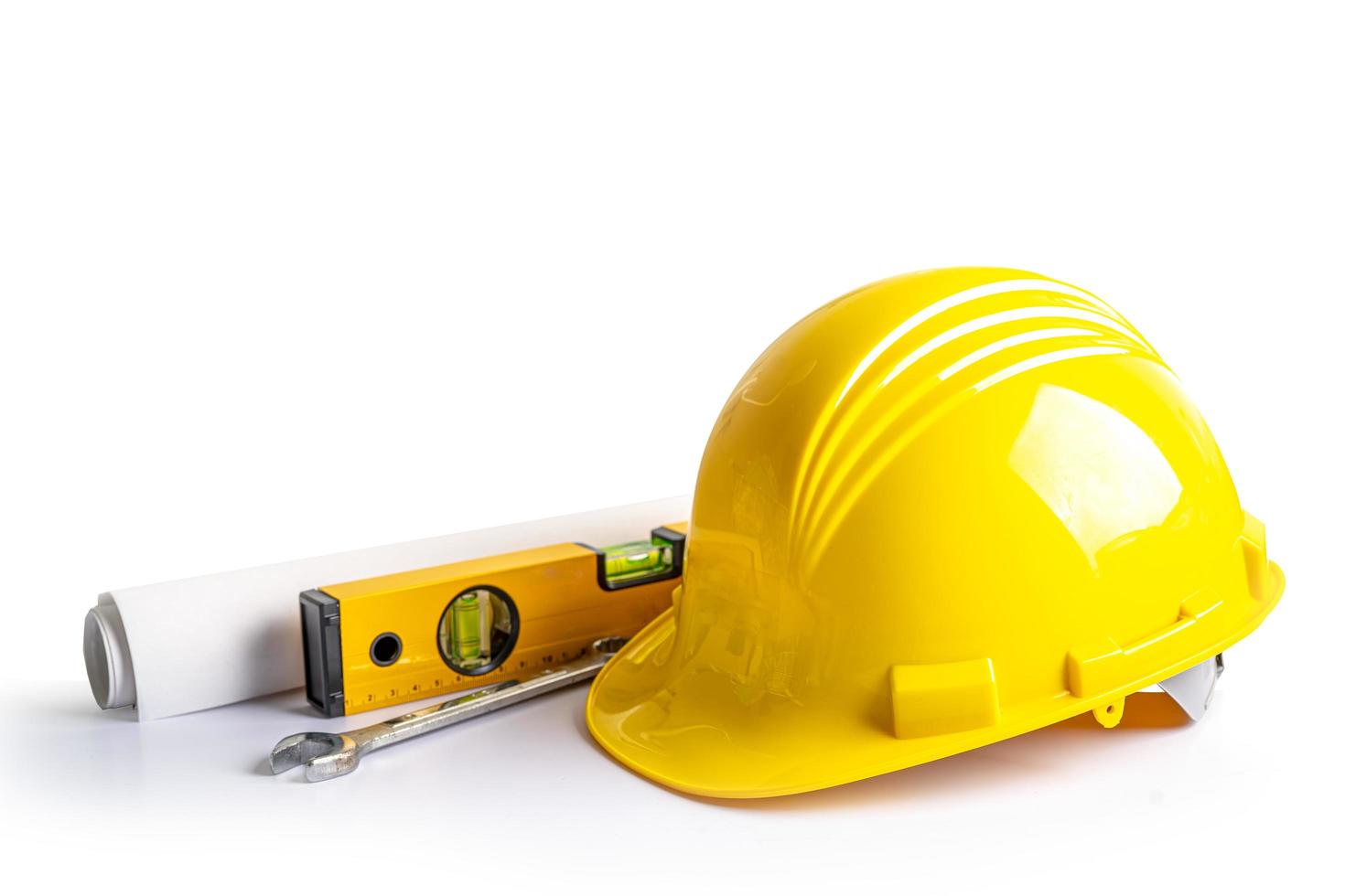 Construction helmet and tools for engineering work project on white background with clipping path. photo