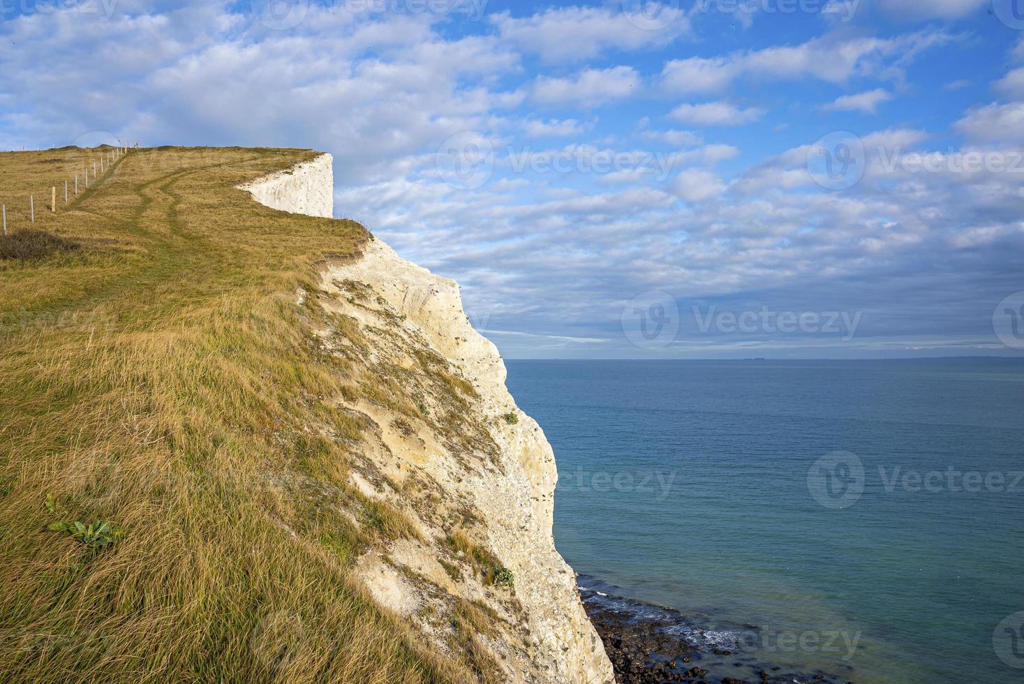 Scenic view of white cliffs with sea on sunny day photo