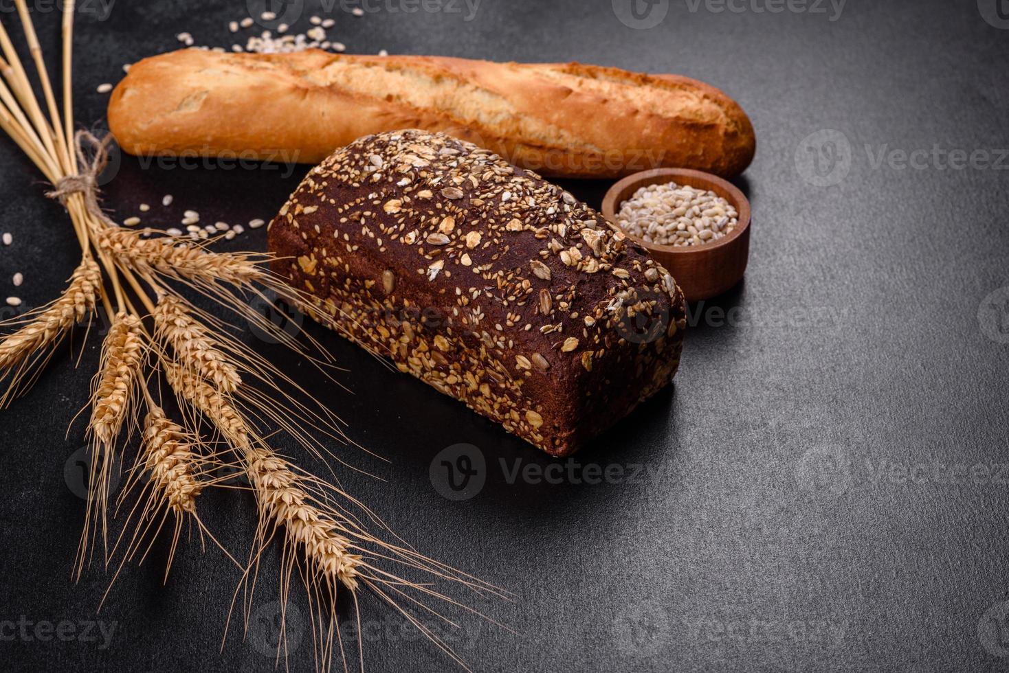 Fresh Bread on black background, top view, copy space photo