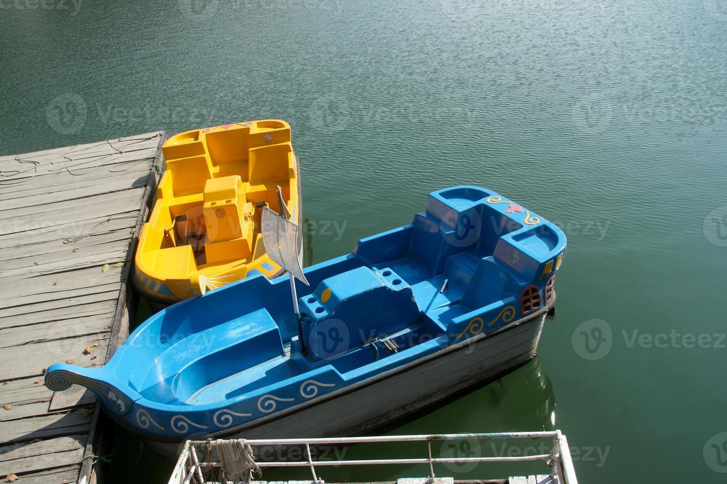 Bright blue and yellow boats photo