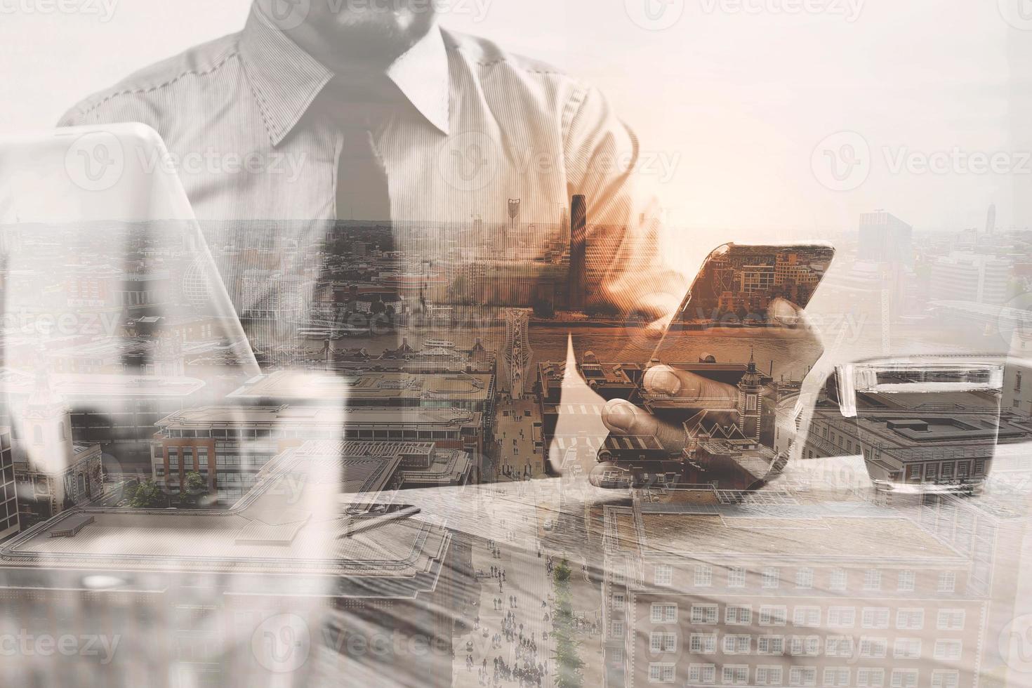 Double exposure of success businessman using smart phone,digital tablet docking smart keyboard  with London building,city,filter effect photo