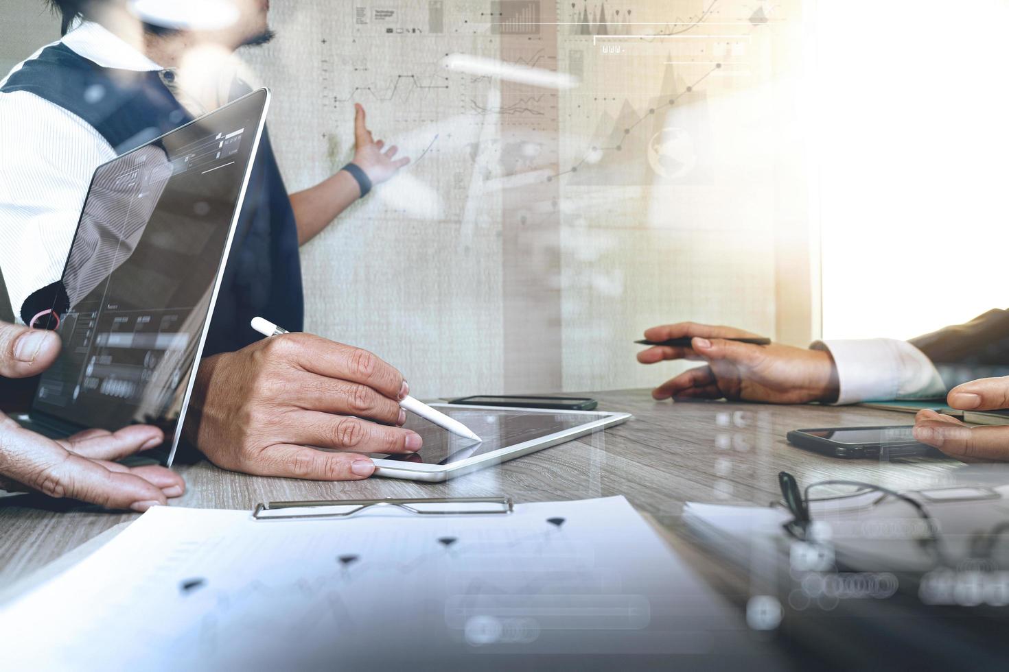 Businessman making presentation with his colleagues and business strategy digital layer effect at the office as concept photo