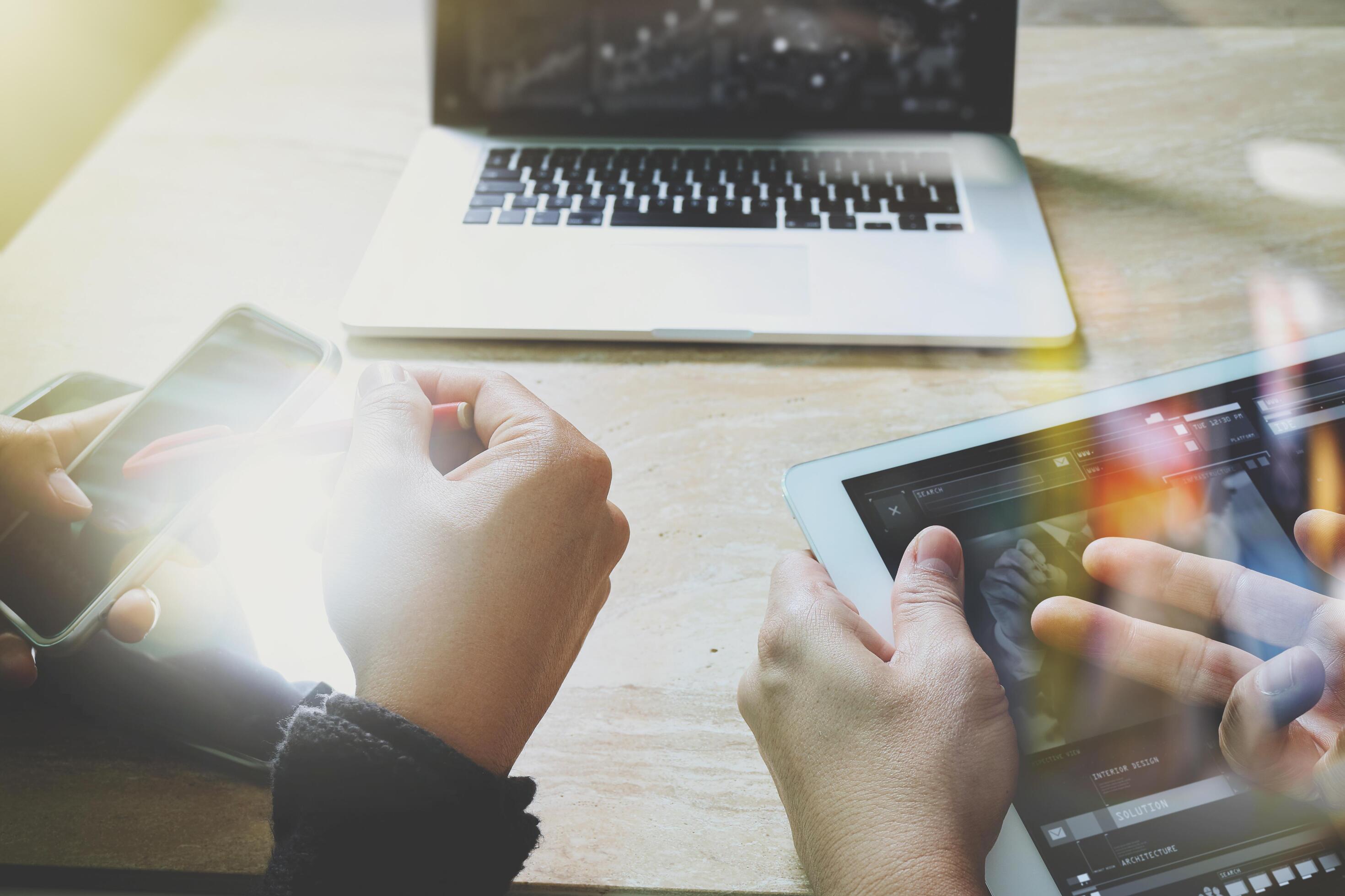Businessman making presentation with his colleagues and business tablet ...