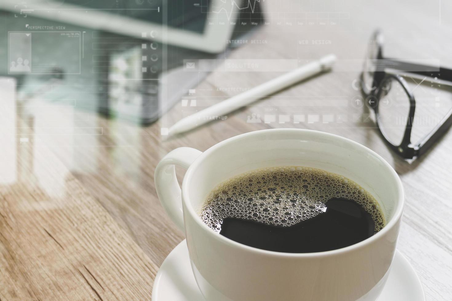 Coffee cup and Digital table dock smart keyboard,eyeglasses,stylus pen on wooden table,filter effect photo