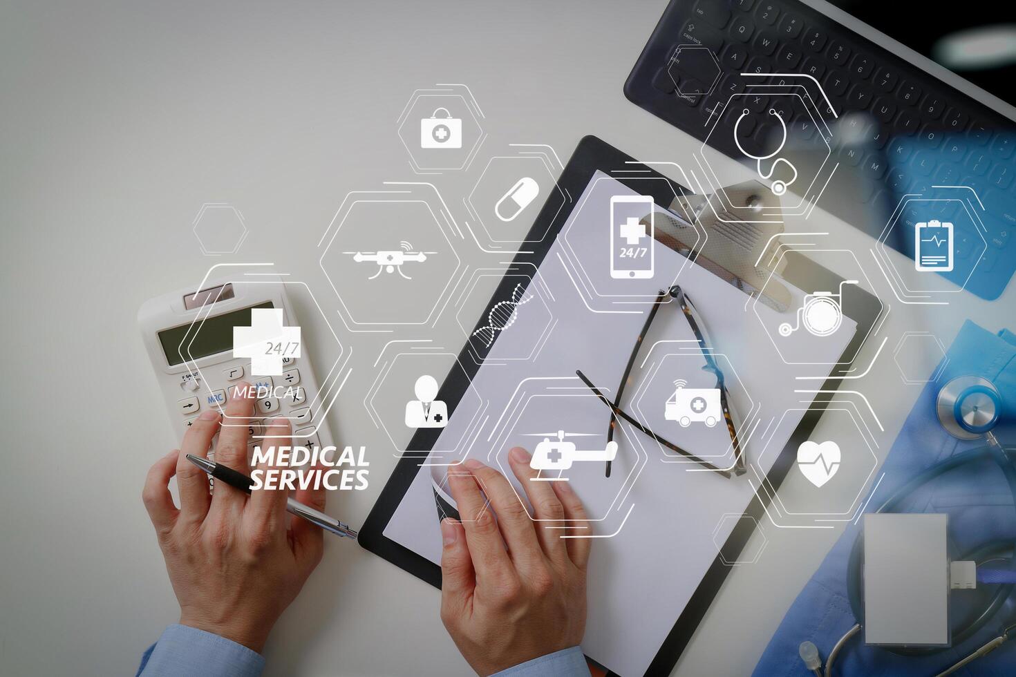 top view of Healthcare costs and fees concept.Hand of smart doctor used a calculator for medical costs in modern hospital photo