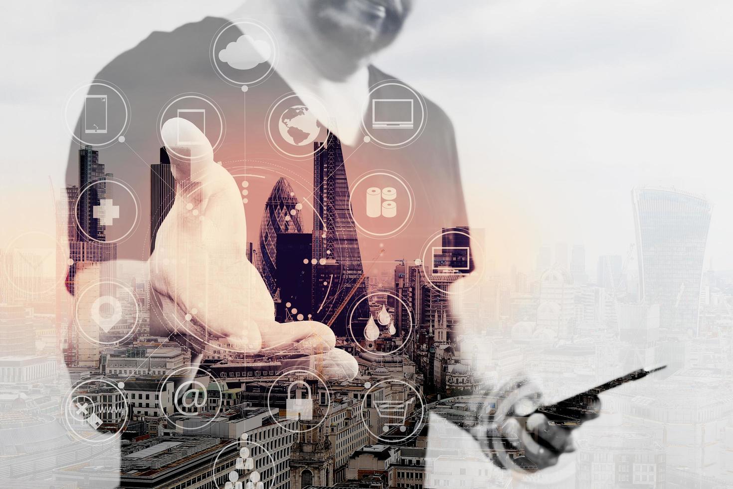 Double exposure of Designer hand pressing an imaginary button,holding smart phone,digital screen graphic virtual icons,channel,diagram,London architecture photo