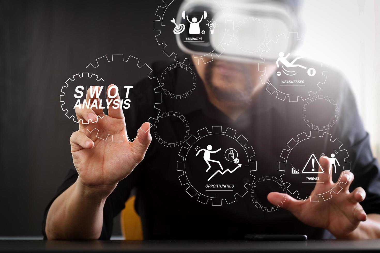 businessman wearing virtual reality goggles in modern office with