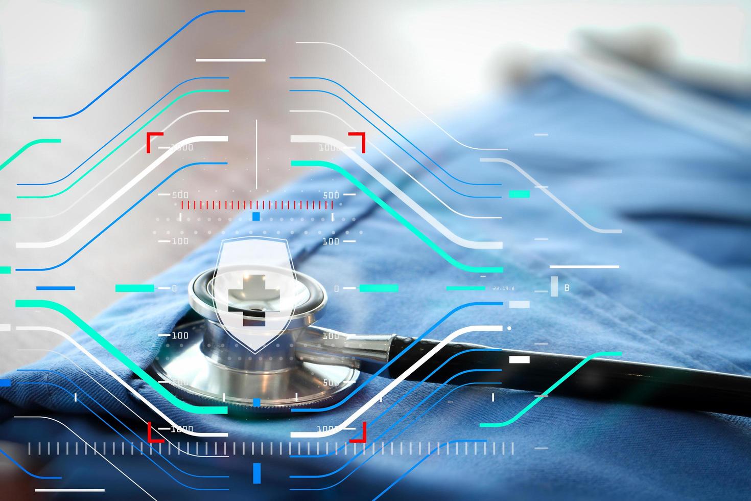 Stethoscope with blue doctor coat on wooden table with shallow DOF evenly matched and background photo