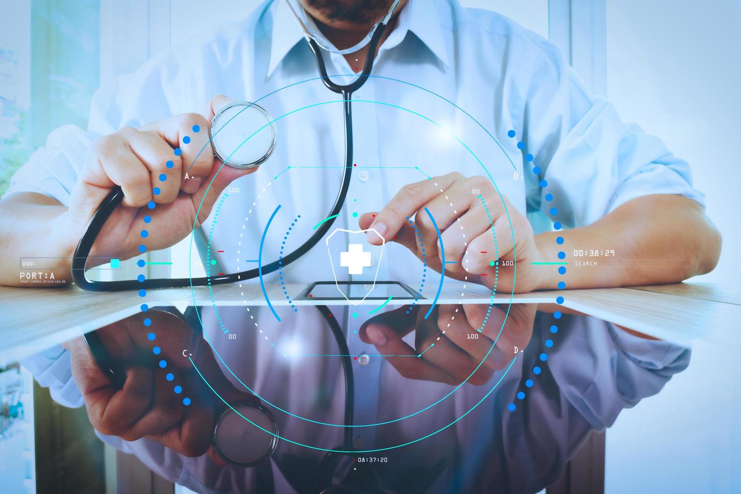 Medicine doctor hand holding stethoscope with modern tablet computer as medical network concept photo