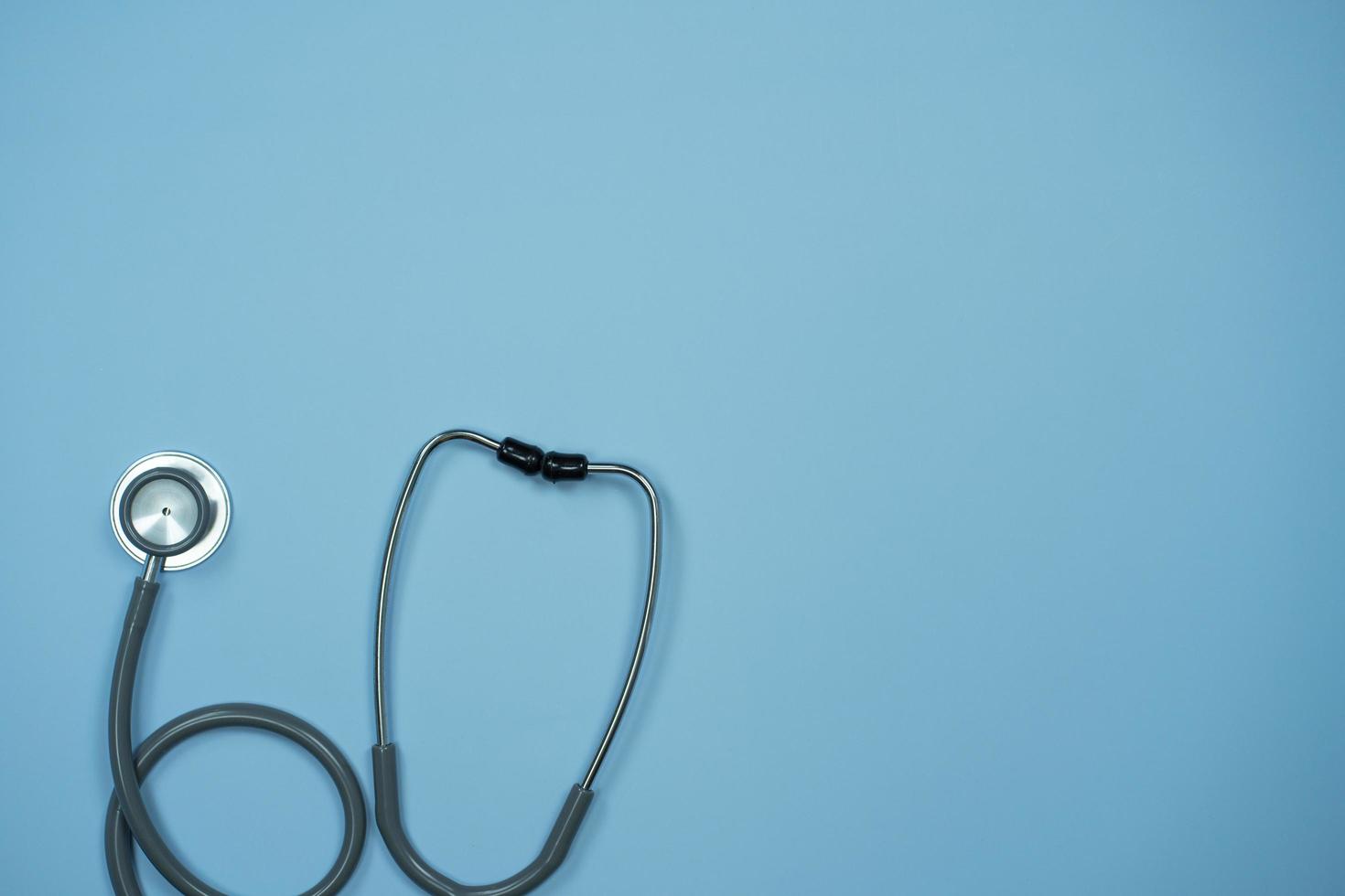 Closeup Stethoscope on pastel blue background with copy space, Health concept. photo