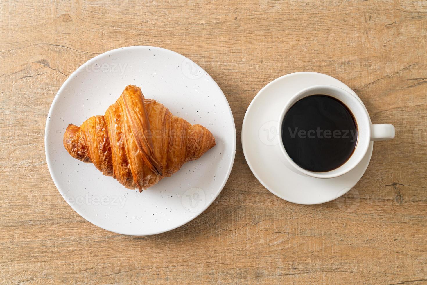 fresh croissant on white plate photo