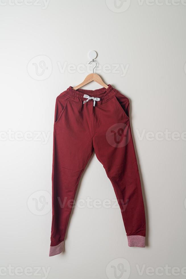 sweatpants or jogger pants hanging on wall photo