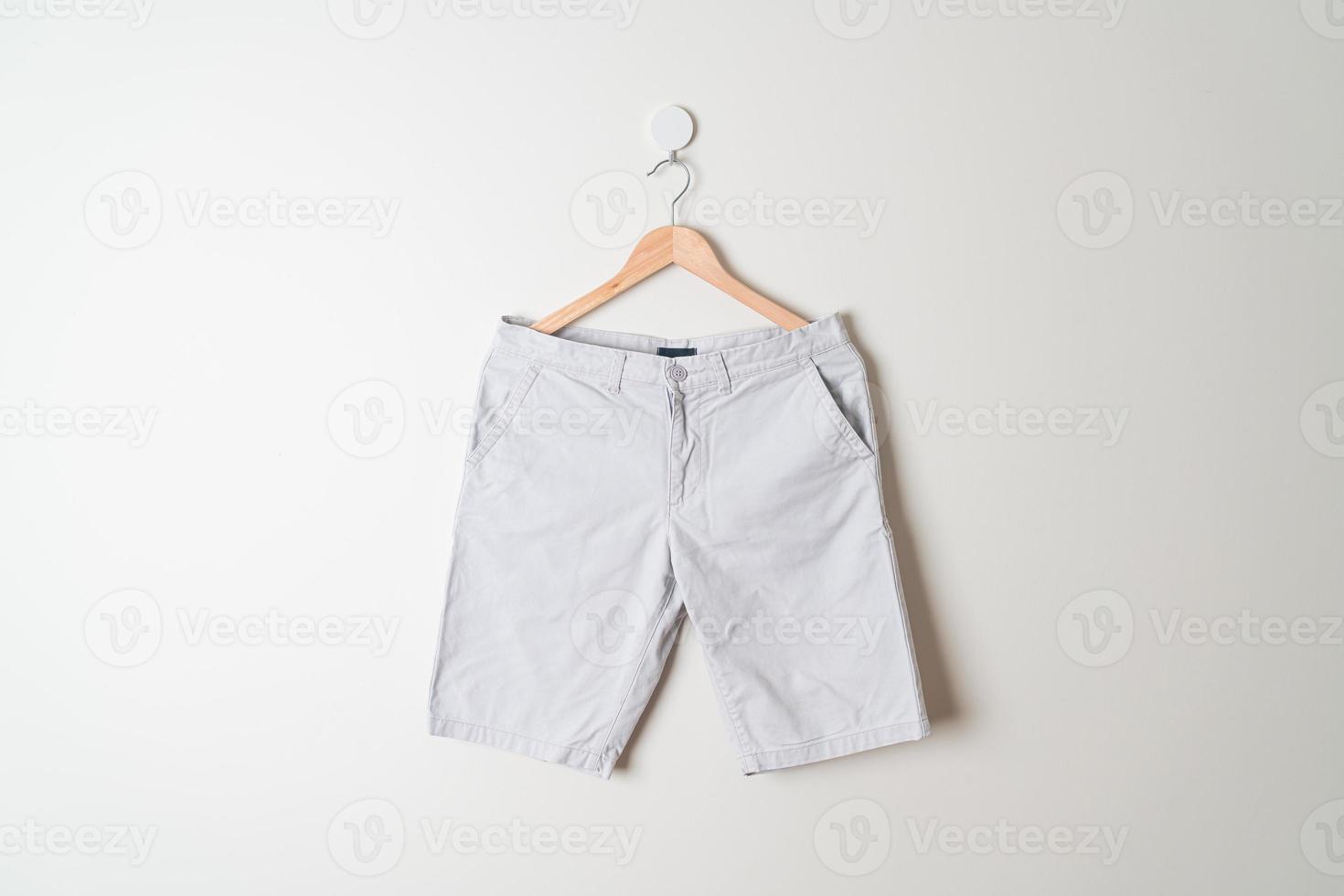 short pants hanging on wall photo