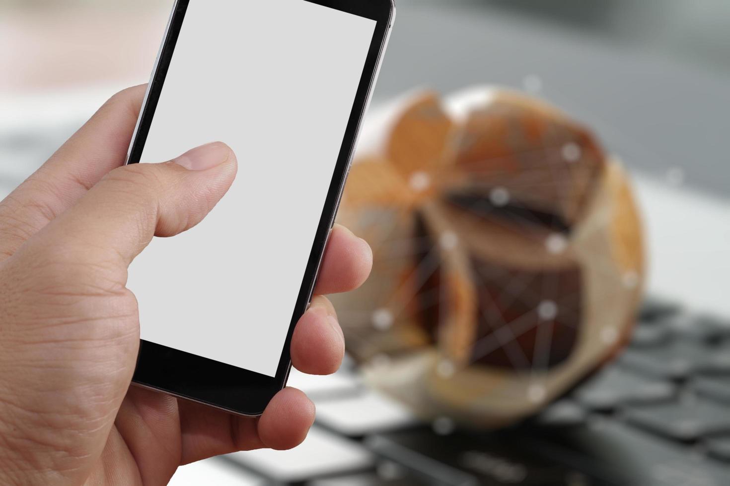 Closeup of Hand holding Blank Screen of Smart phone with blurred background as concept photo