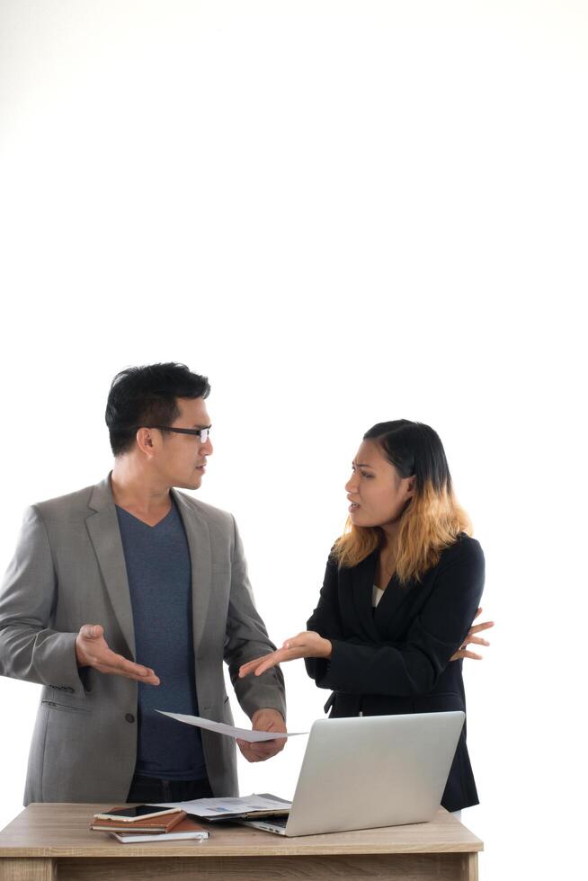 Young business woman standing with her boss conversation about the business at office isolated on white background. photo