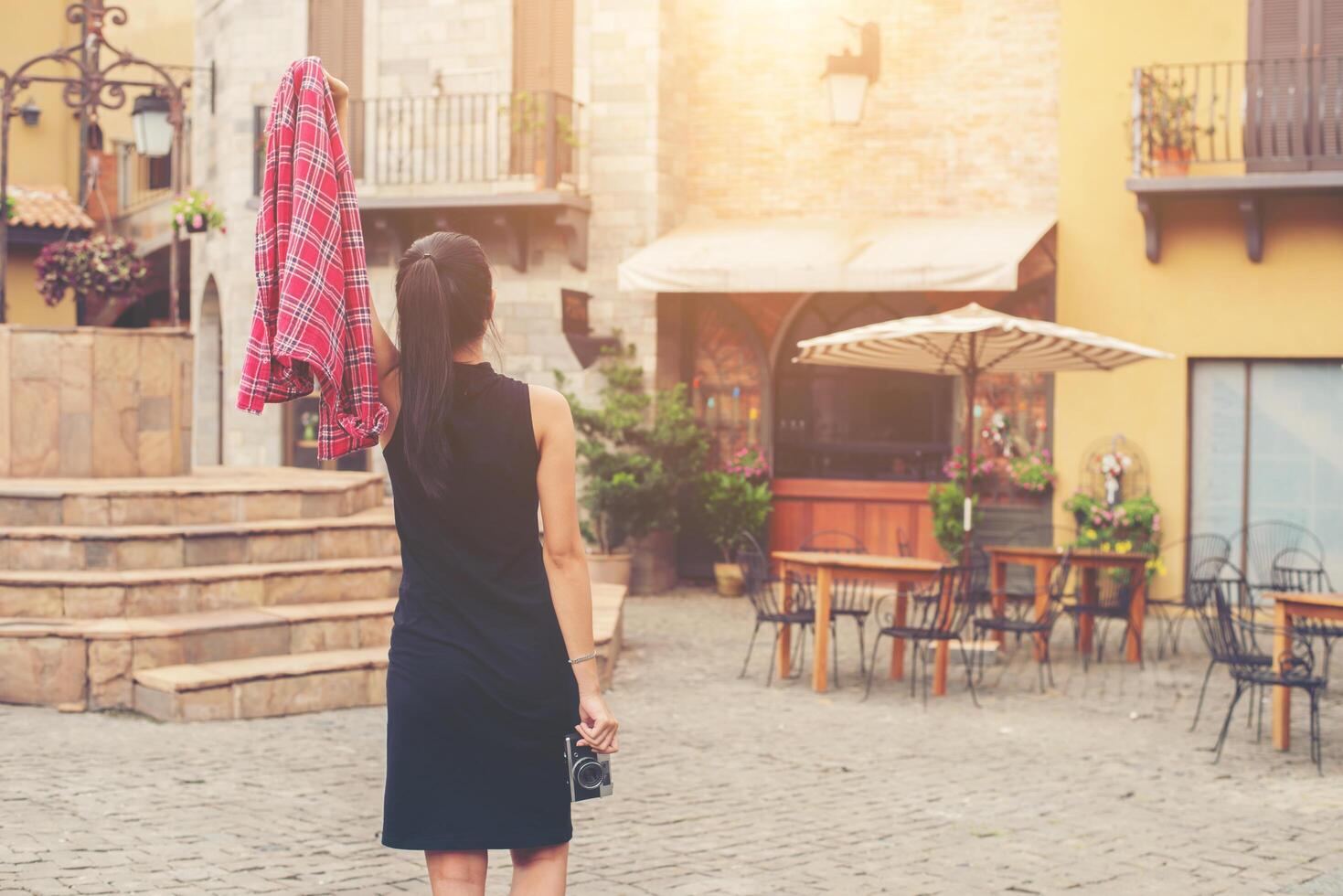 Young beautiful woman with retro camera , Vintage retro style Asian girl on vacation smiling happy. photo