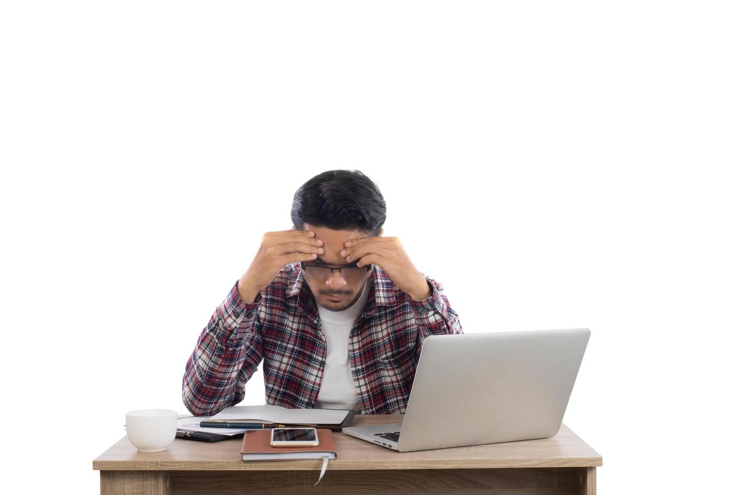 Worried businessman lamenting in front of a computer after got mistake at office. photo