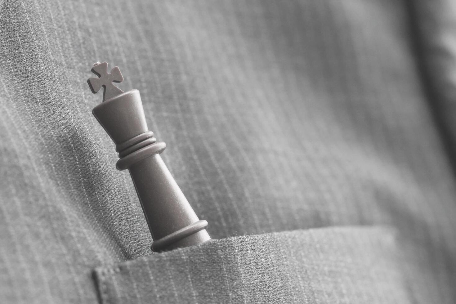 close up of chess figure on suit background strategy or leadership concept photo