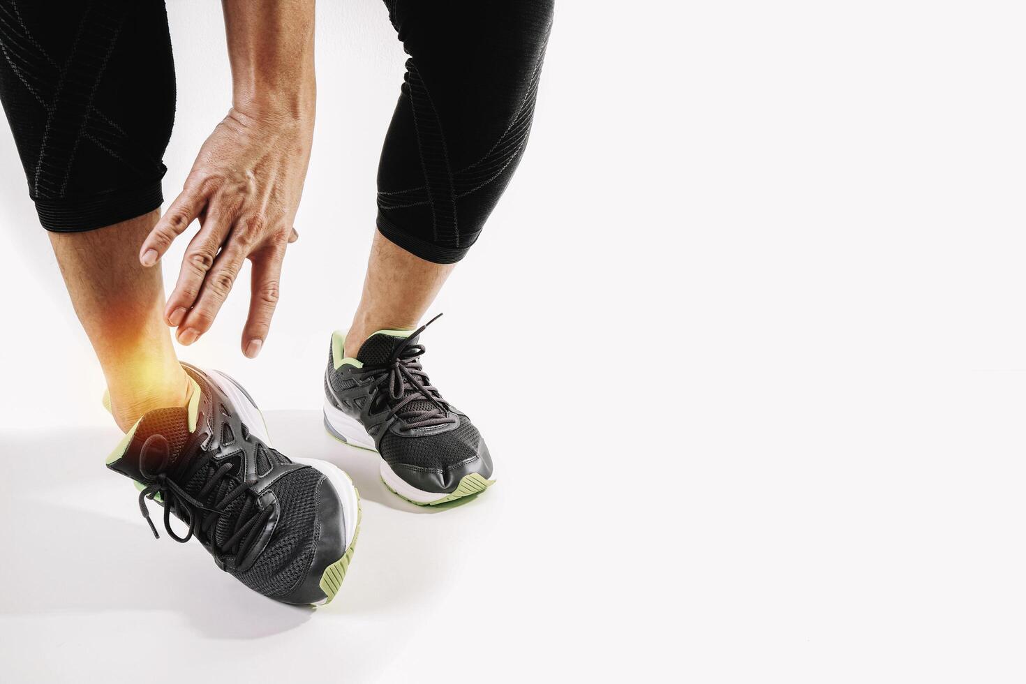 Runner sportsman holding ankle in pain with Broken twisted joint running sport injury and Athletic man touching foot due to sprain on white background 5296930 Stock Photo at Vecteezy Runner sportsman holding ankle in pain with Broken twisted joint running sport injury and Athletic man touching foot due to sprain on white background 5296930 Stock Photo at Vecteezy