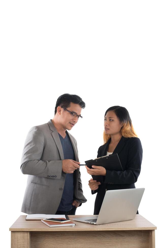 Young business woman standing with her boss conversation about the business at office isolated on white background. photo