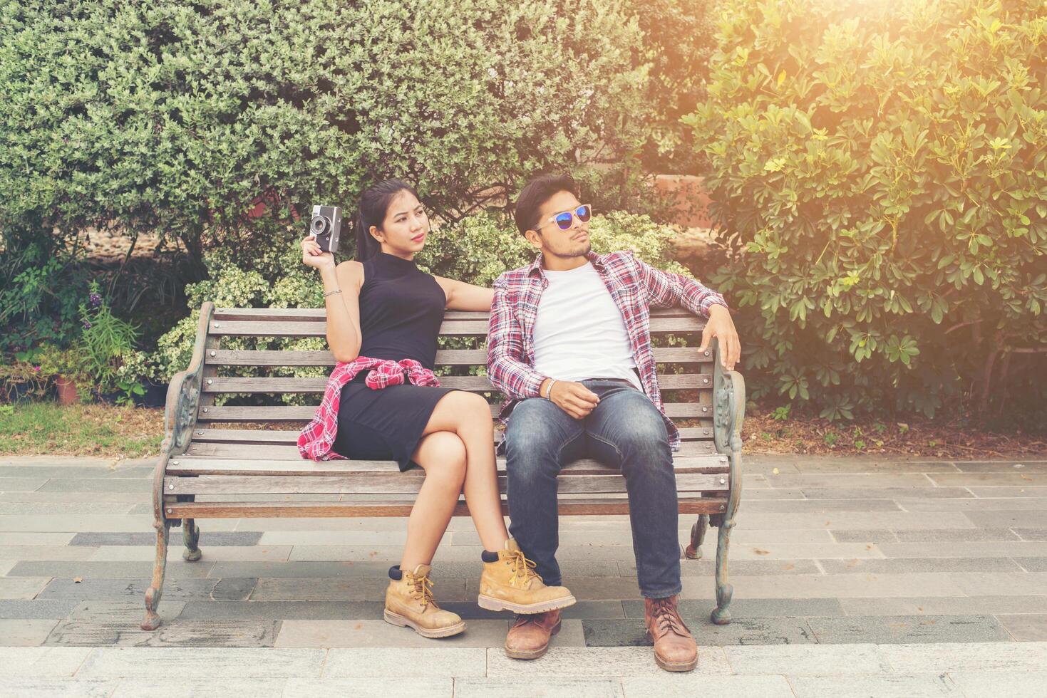 Young hipster couple teenagers in love in the city, Summer holiday enjoyment together. photo