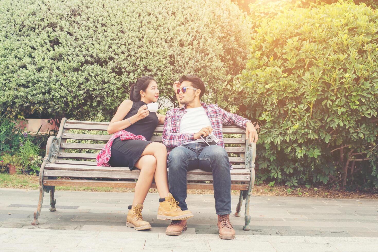 Young hipster couple teenagers in love in the city, Summer holiday enjoyment together. photo