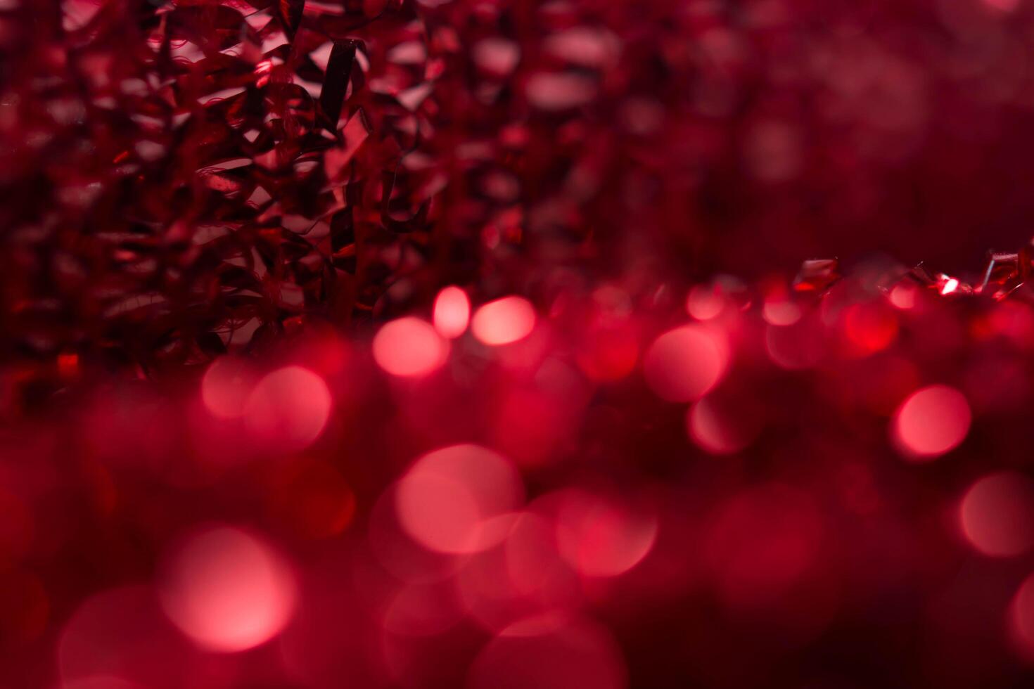 Red bokeh holiday textured Christmas decorations background photo