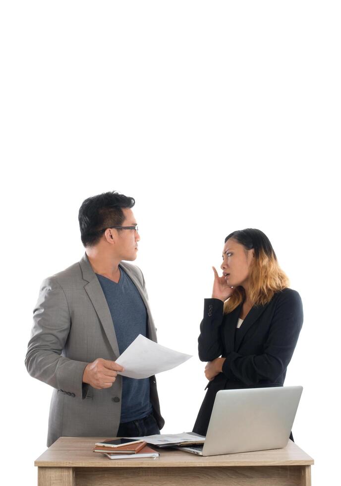 Young business woman standing with her boss conversation about the business at office isolated on white background. photo