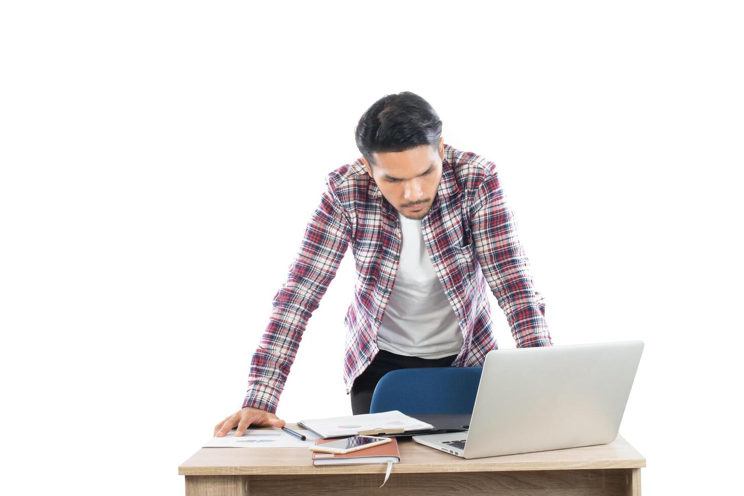 Young businessman working with his laptop isolated on white background. photo