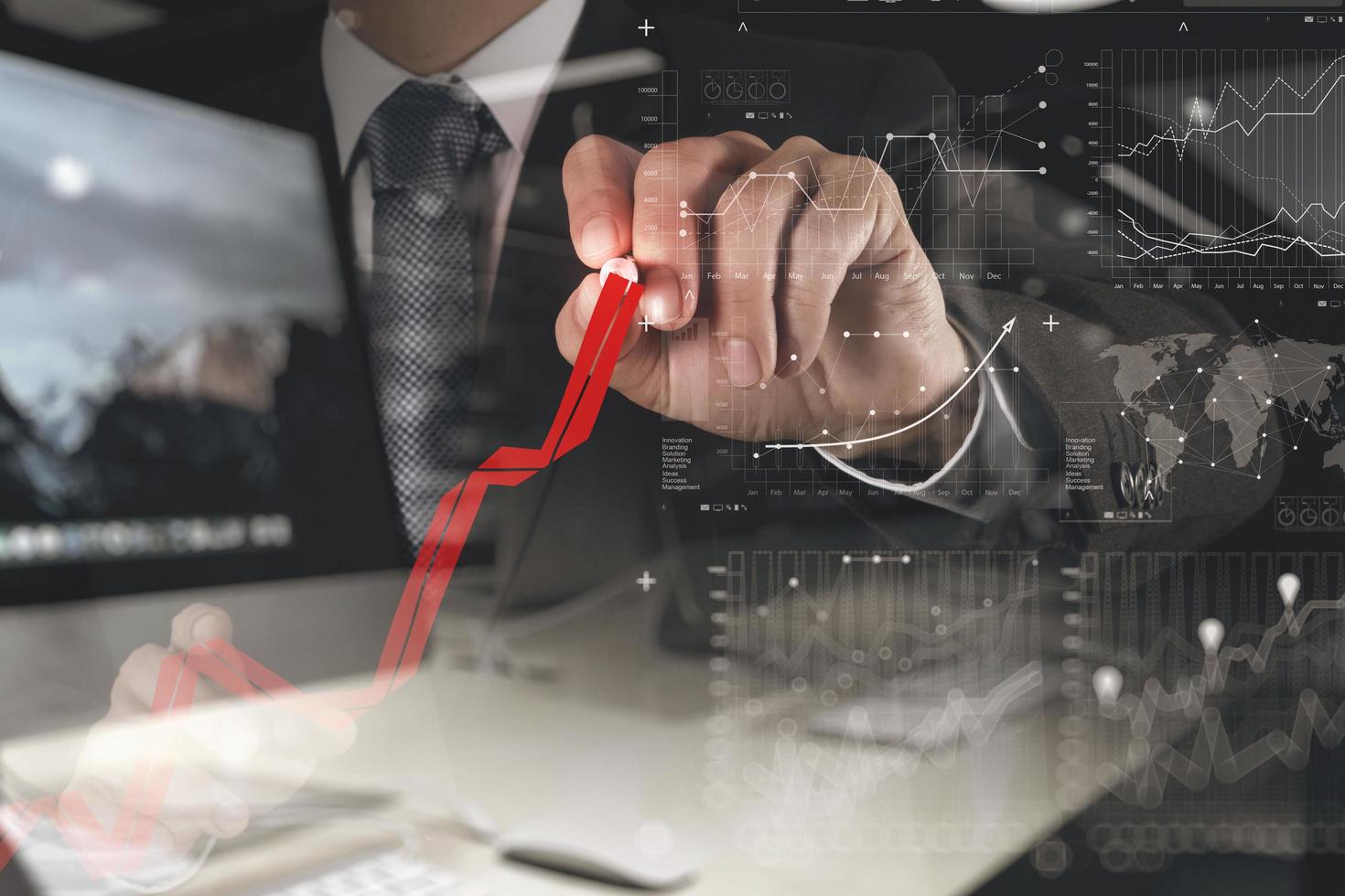 businessman hand working with new modern computer and business strategy photo