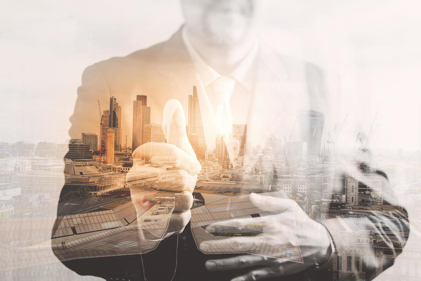 Double exposure of success businessman showing hand thumb with London building,city,river,Bigben,front view,filter effect photo