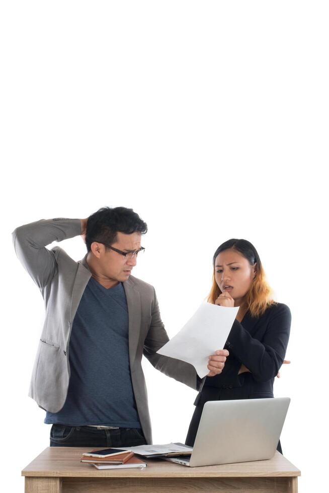 Young business woman standing with her boss conversation about the business at office isolated on white background. photo